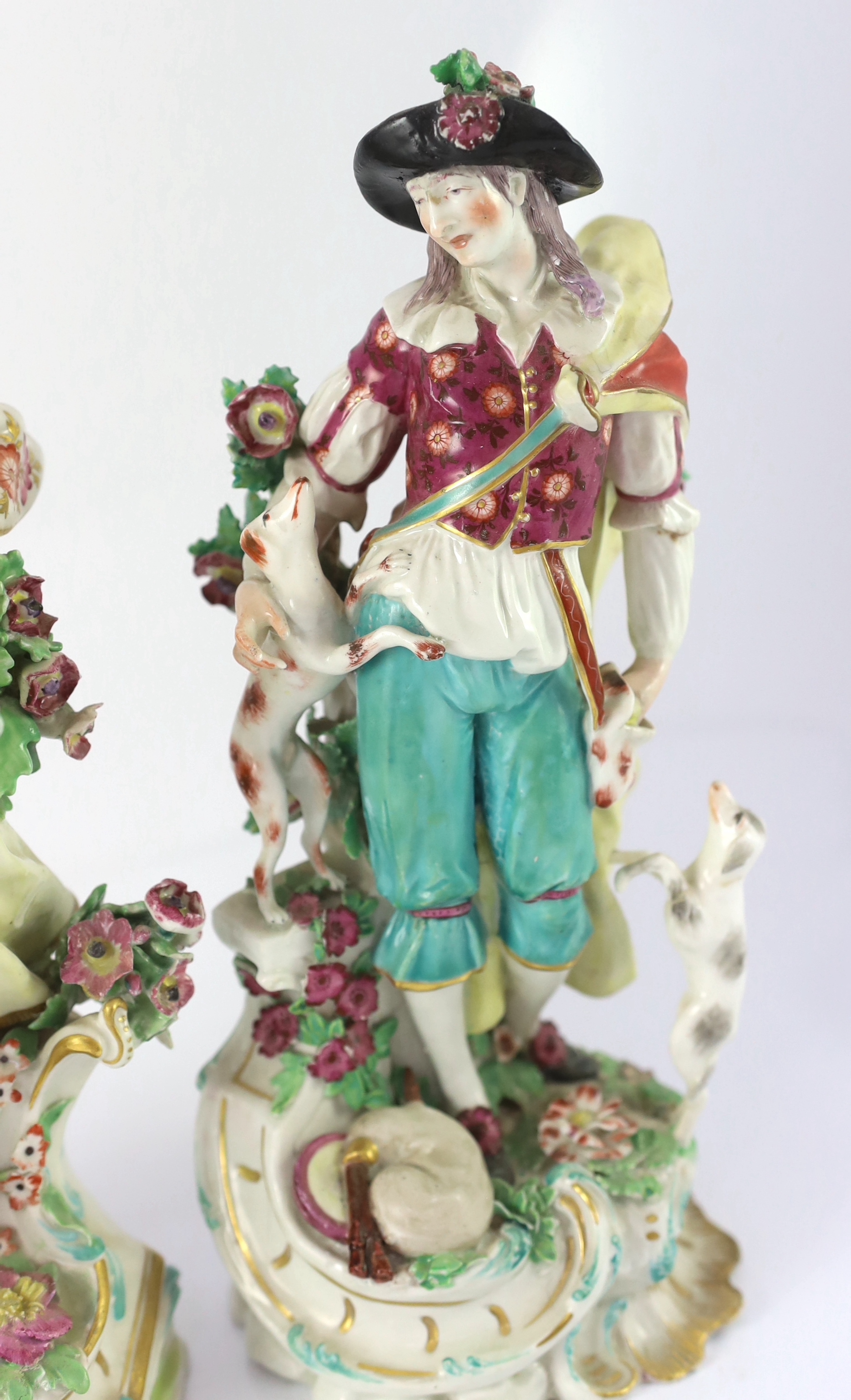 NB shepherdess head restored. A pair of Chelsea porcelain groups of a shepherd and shepherdess , c.1760-65